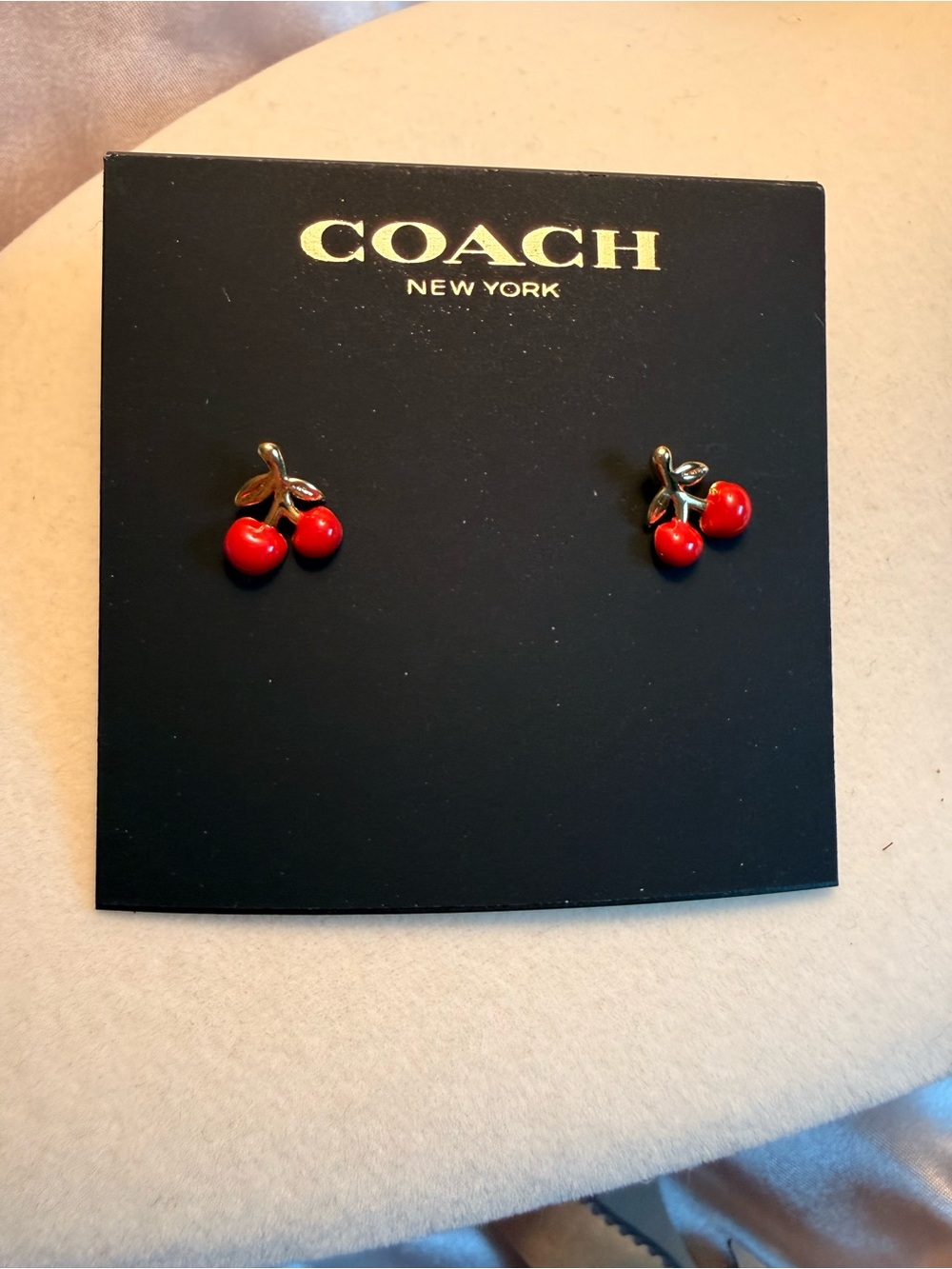 Earrings on Coach Card